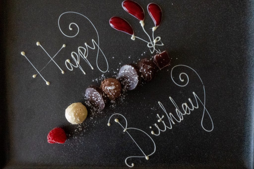 happy birthday word with chocolates