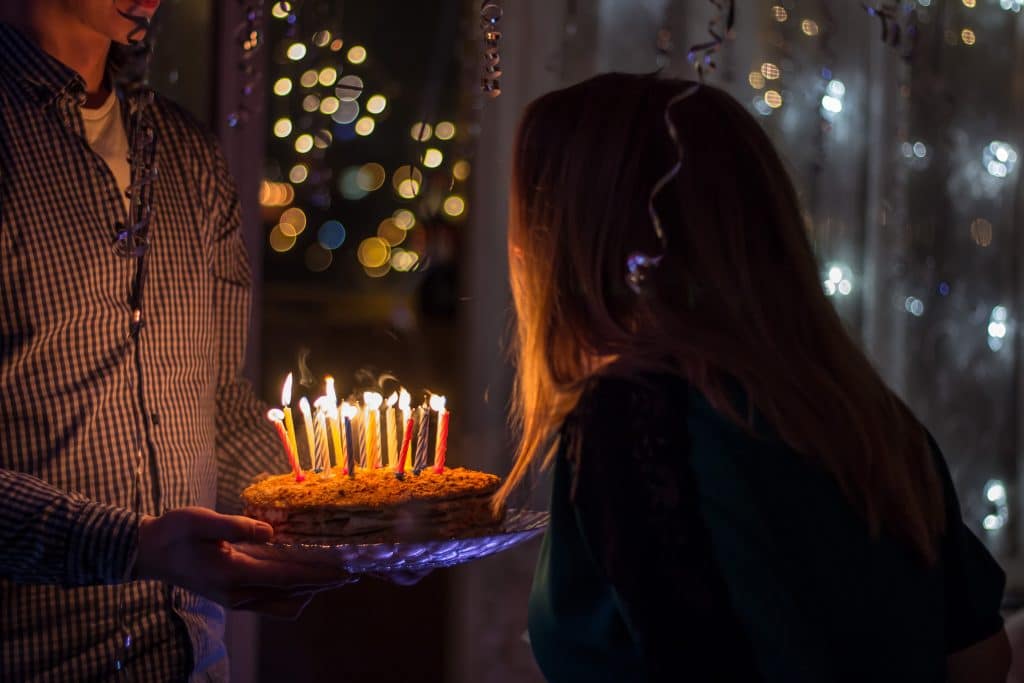 woman about to blow birthday candles