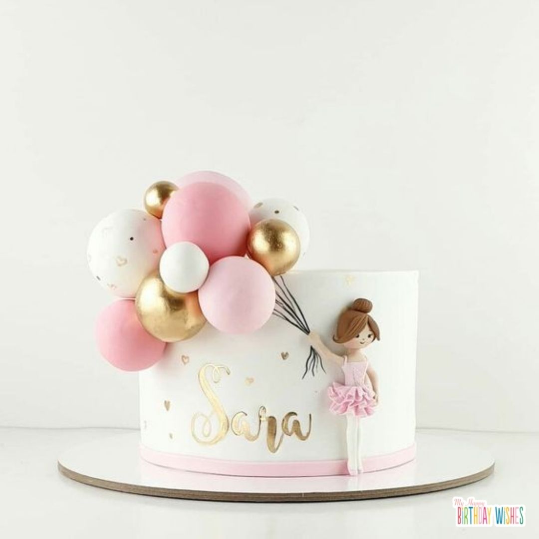 cute christening cake with girl design and mini balloons