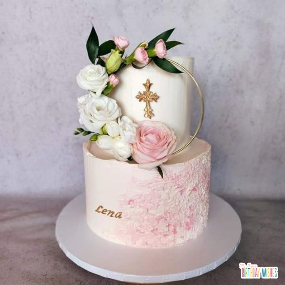 formal christening cake with gradient pink and cross at the center