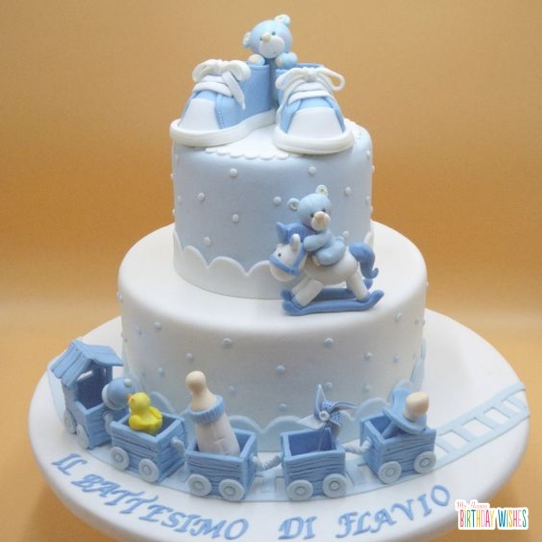 christening cake for boys with shoes and teddy bear