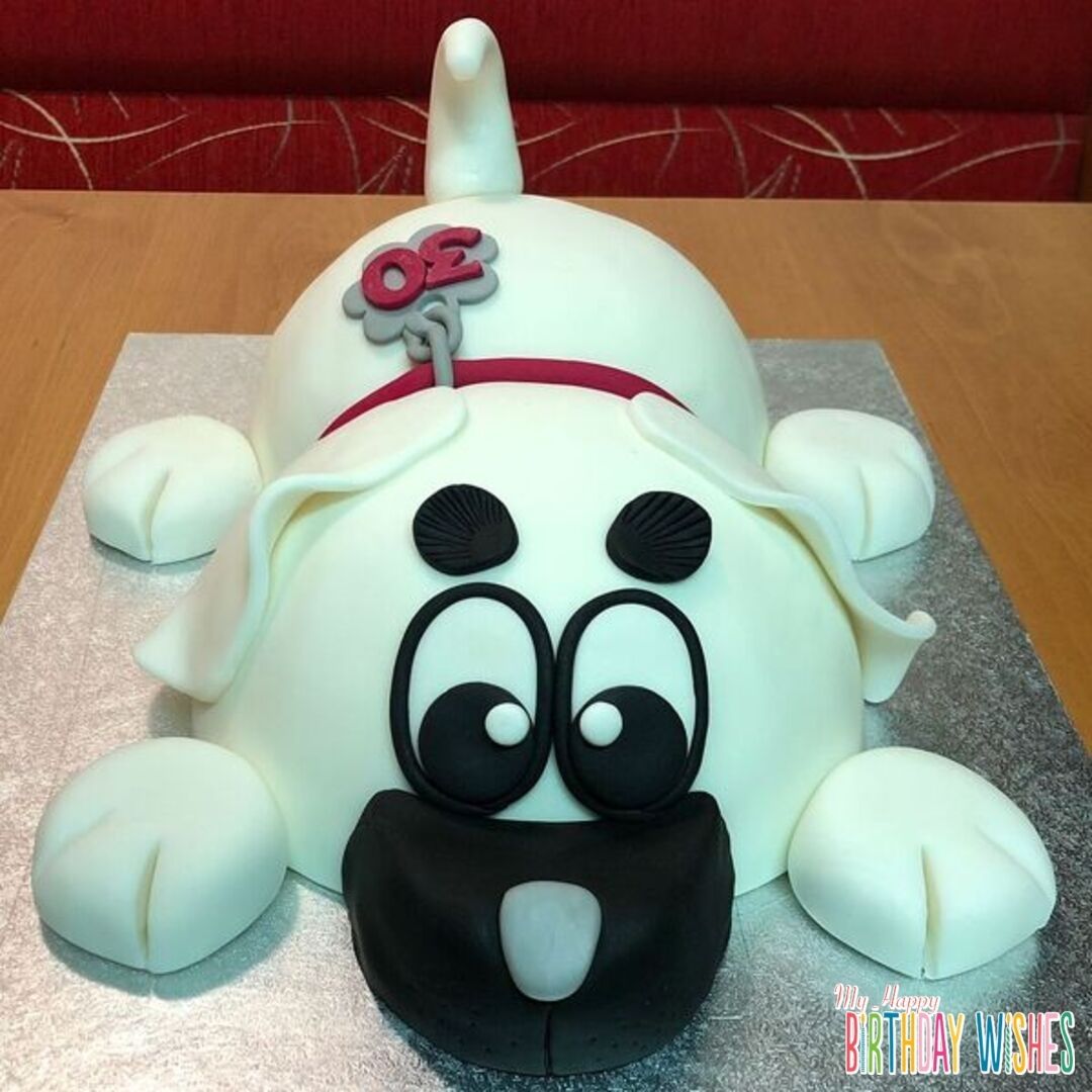 3D Dog Cake - a cake dog in white black fondant. 