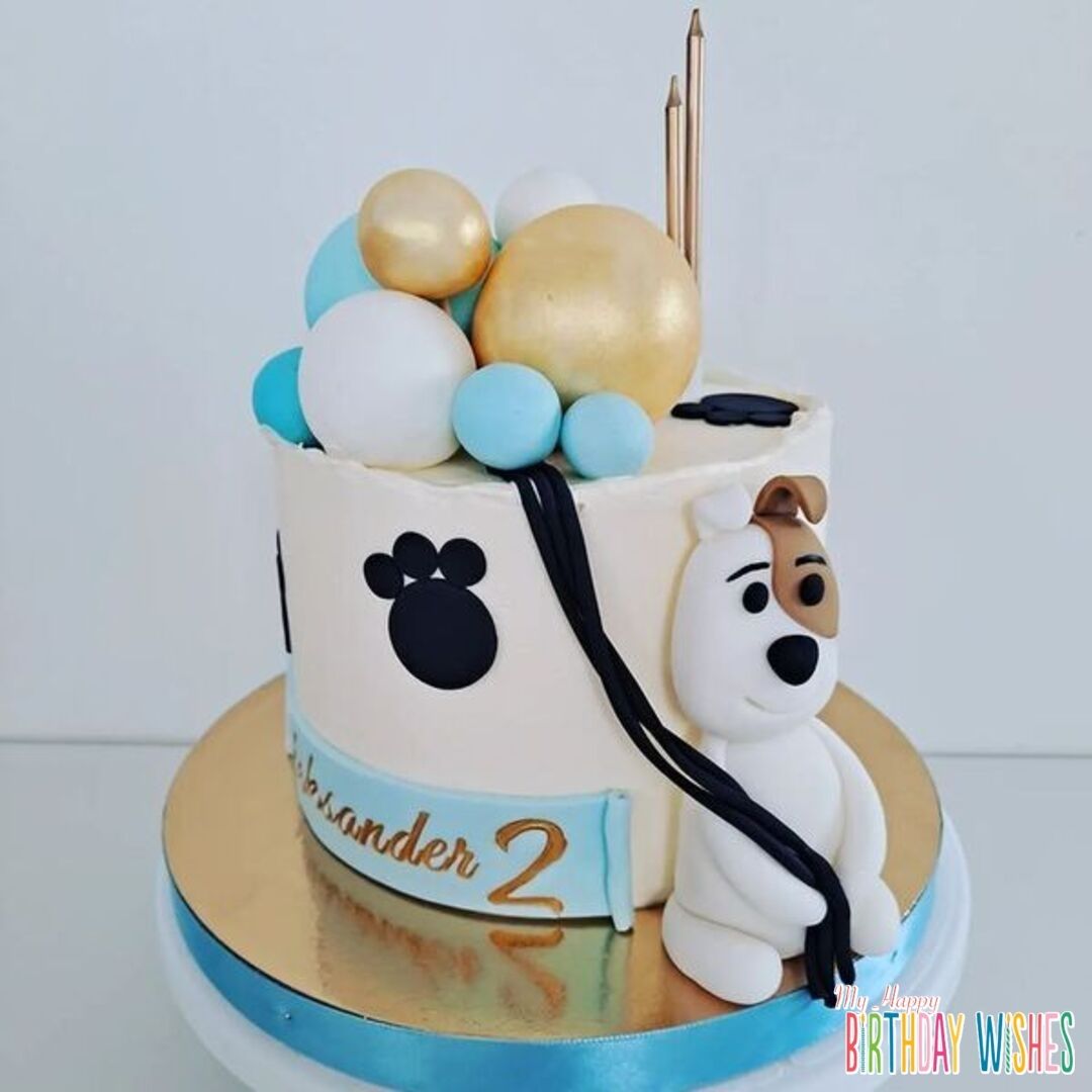 Balloon Cake Dog Designed - a dog cake with long candles with paw designs. 