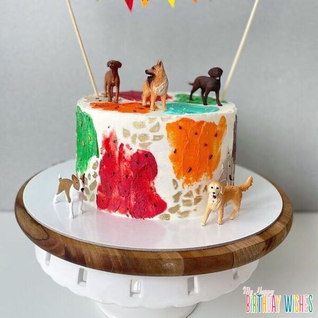 Colorful Dog Cake Miniature - a colorful icing patch with five miniature dogs.