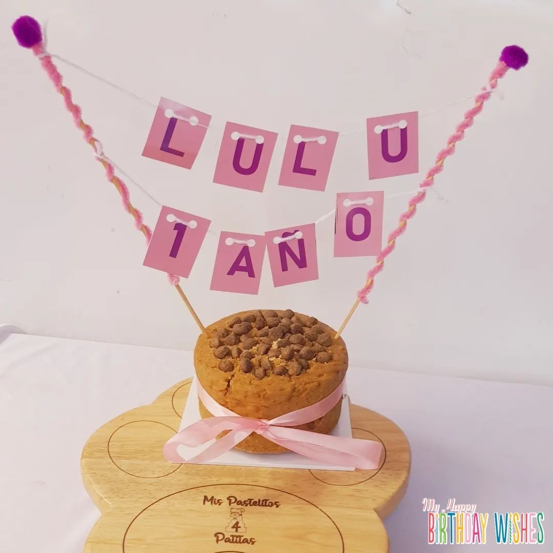Cookie Cake with Banner - a cookie cake with chocolate kisses on top with pink banner.