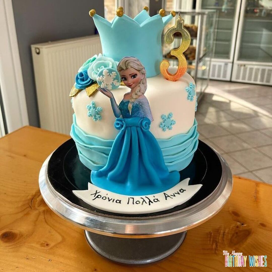 Crown Fondant Frozen Elsa Cake with half body elsa pic and fondant skirt.
