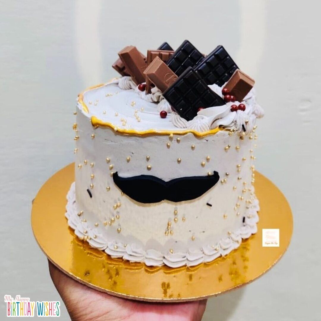 Dad's Birthday Cake in simple medium mustache design on center with chocolate topper.