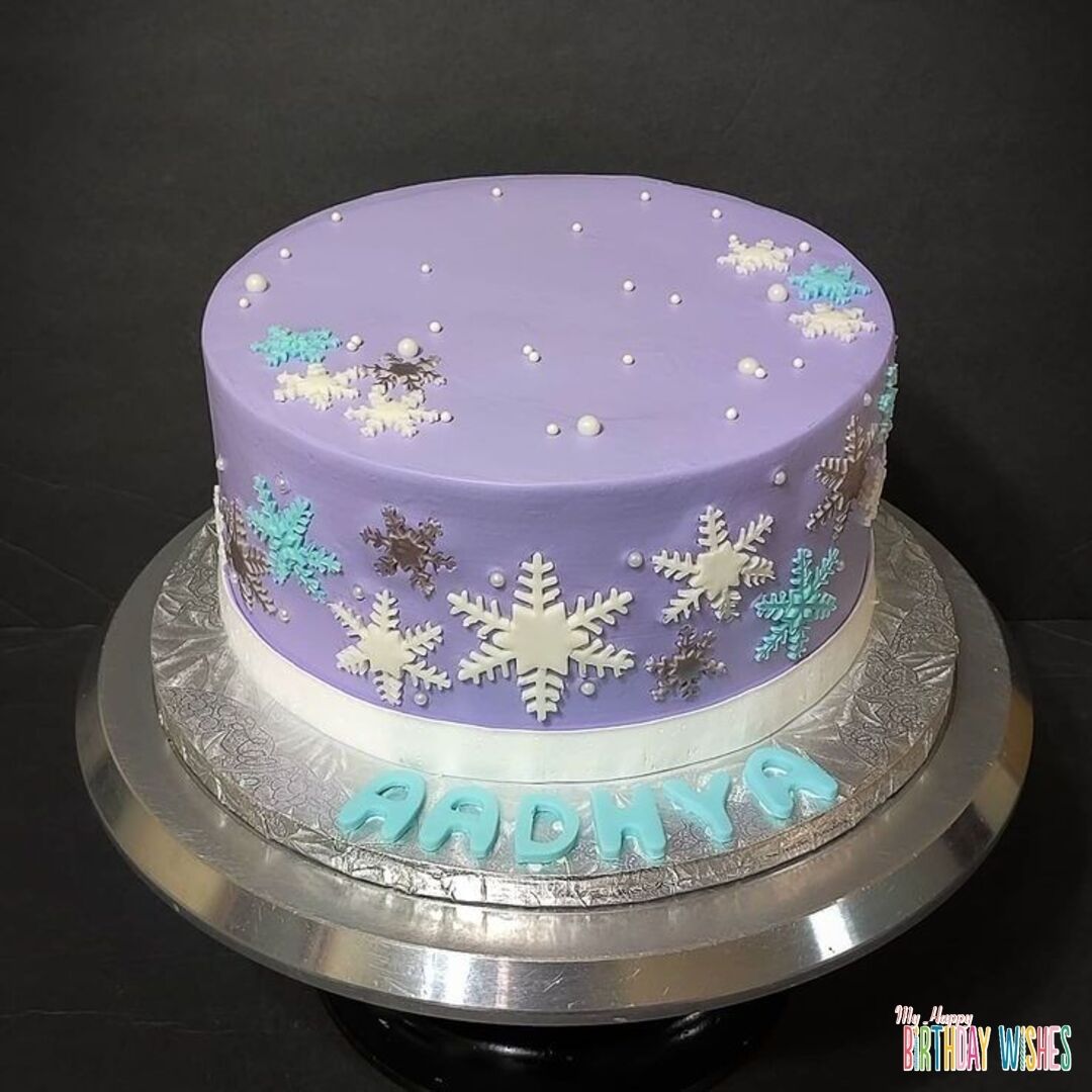 Define Frozen Purple Cake in simple purple color and snow balls and flakes design.