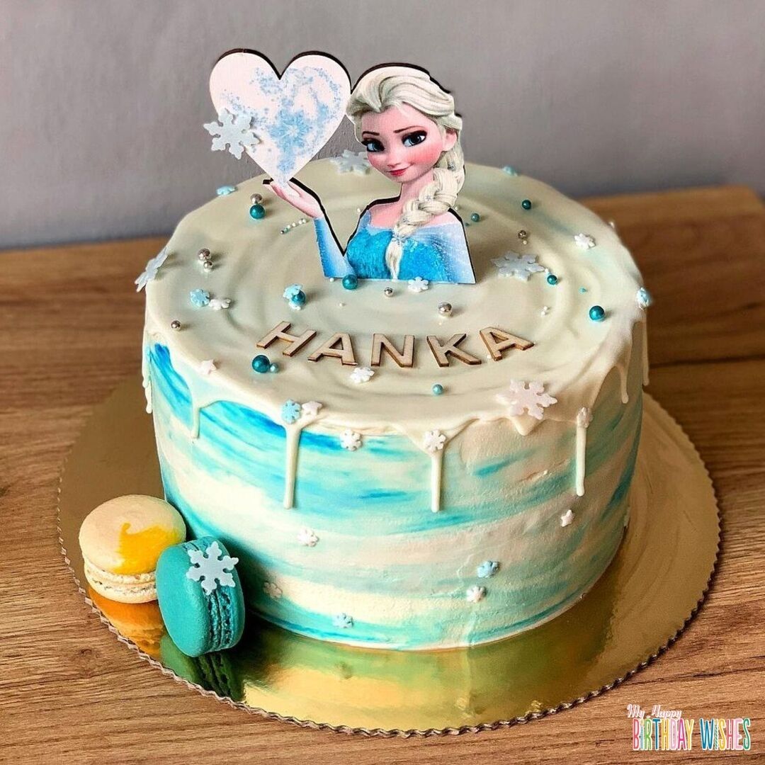 Dipping Elsa Fondant Cake - Elsa topper on top with heart and small balls.