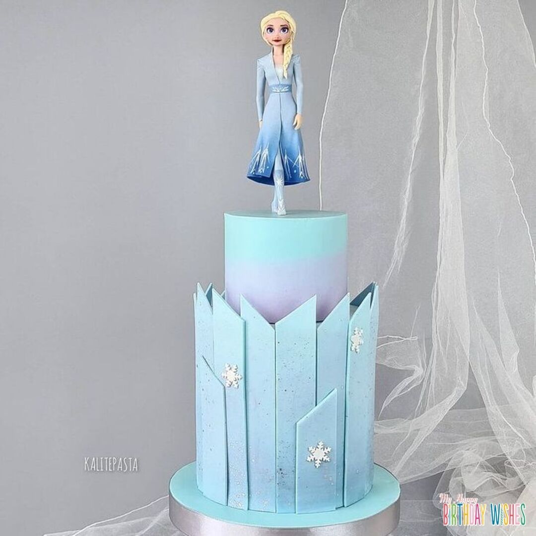 Disney Frozen Glass Castle with braver Elsa fondant cake on top.