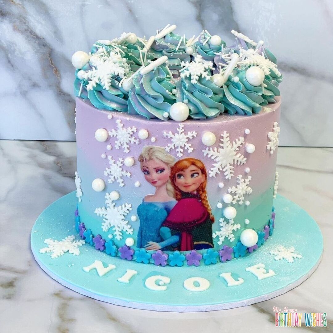 Disney Frozen Sister's Cake in unicorn inspired icing colors with snow balls and flakes.