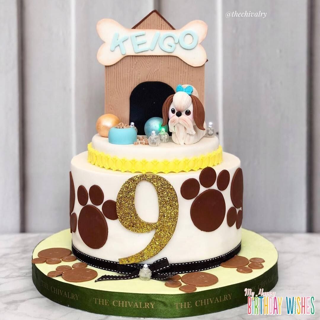 Dog House Cake - a layer cake with house icing candy on top.