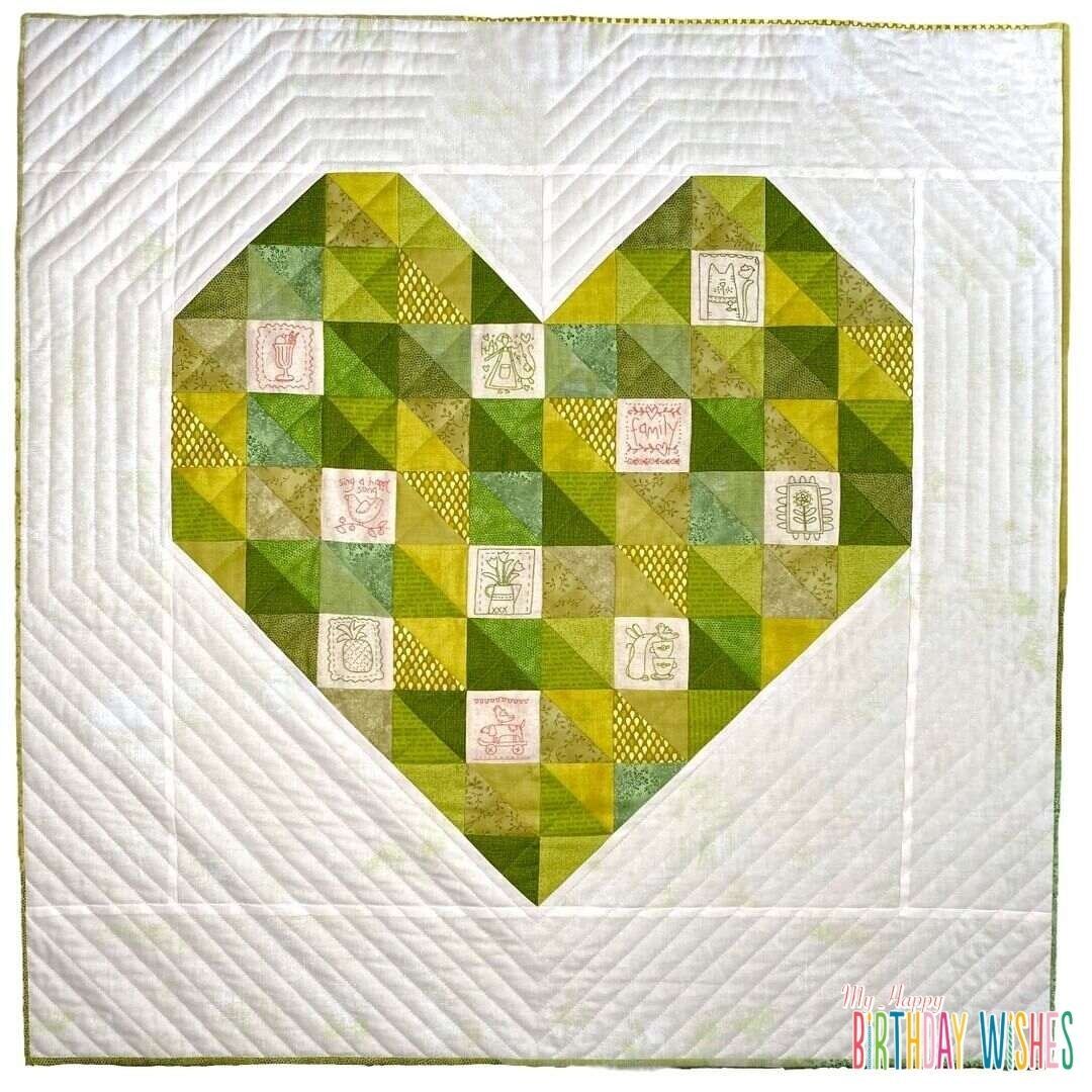 Heart Shape Patchwork Quilt with mixed minimalist square designs combined with different green hue.