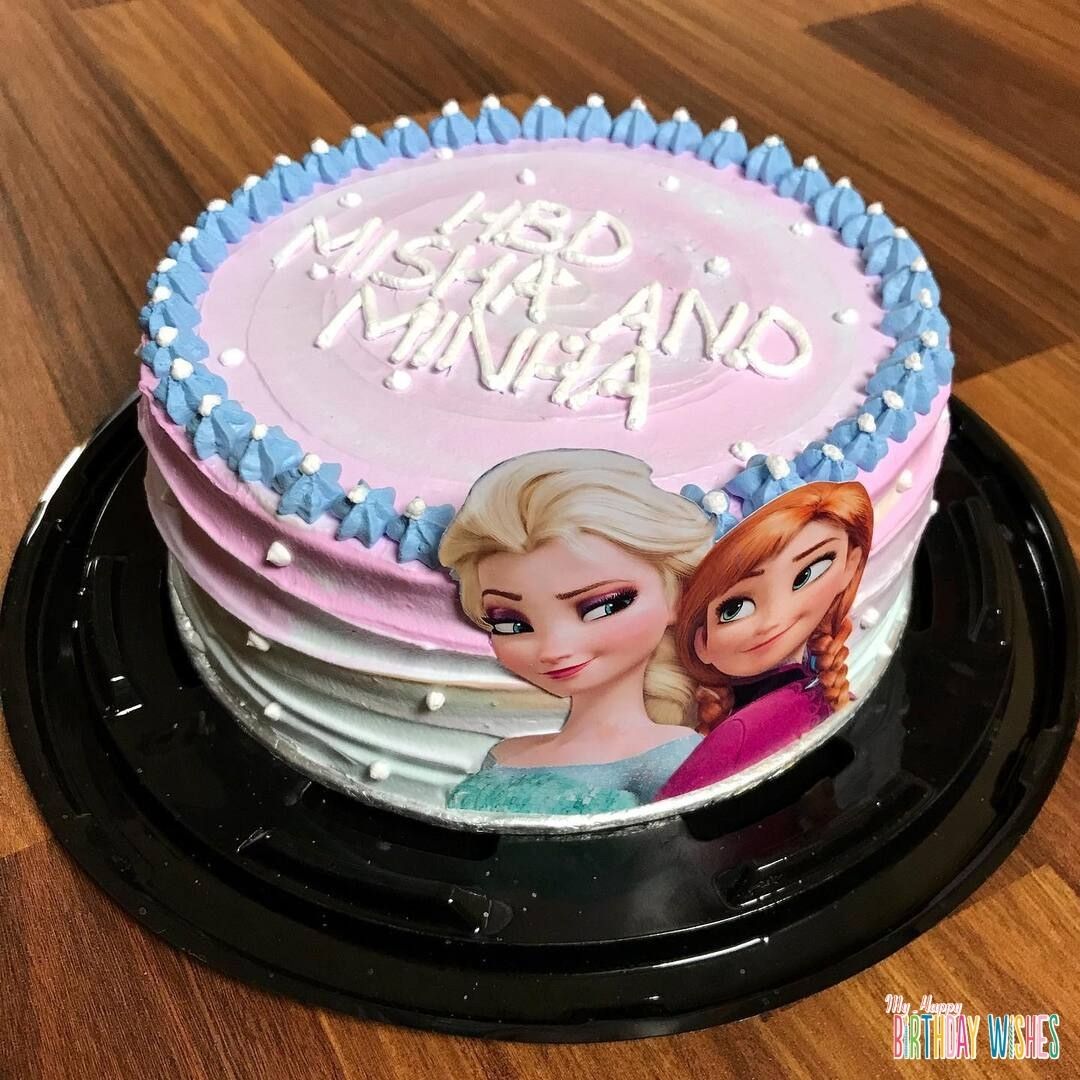 Simple Anna and Elsa Round Cake with small flower icing on top.