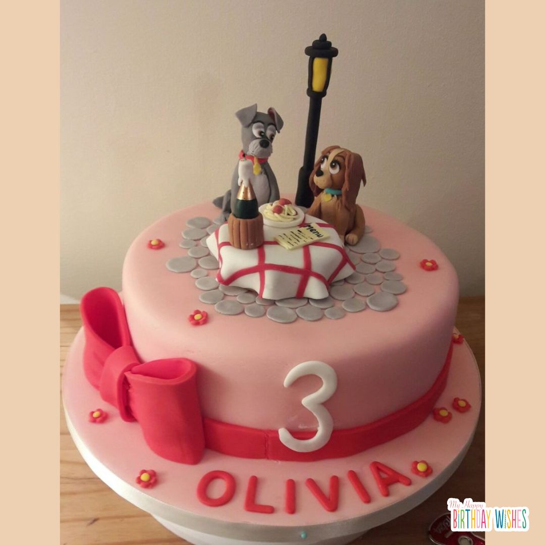 lady and the tramp movie inspired cake with white table and pink ribbon